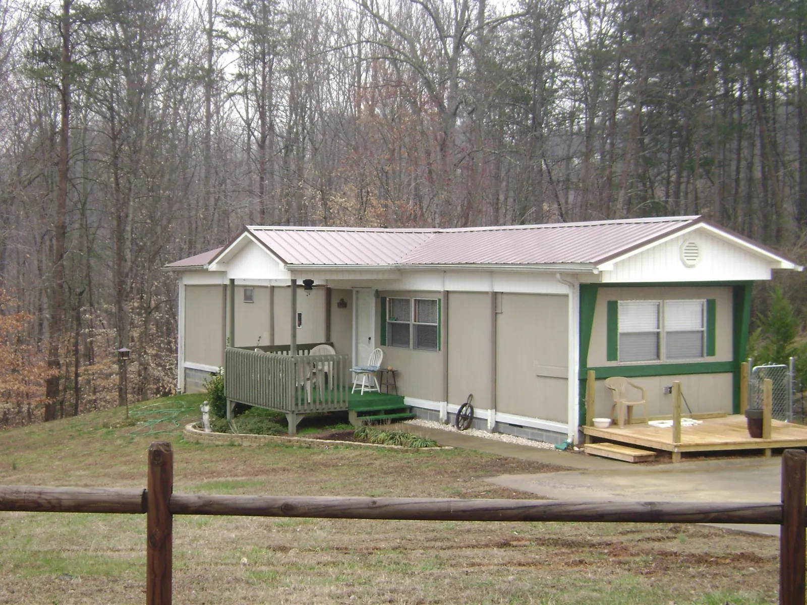 Mauve metal roof on a manufactured home with a new front deck in Panama City
